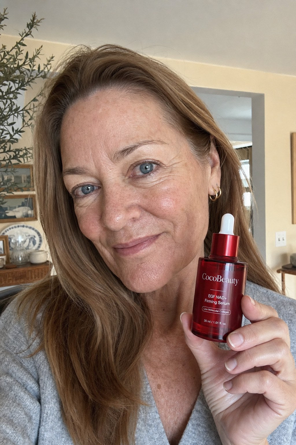Woman holding CocoBeauty serum